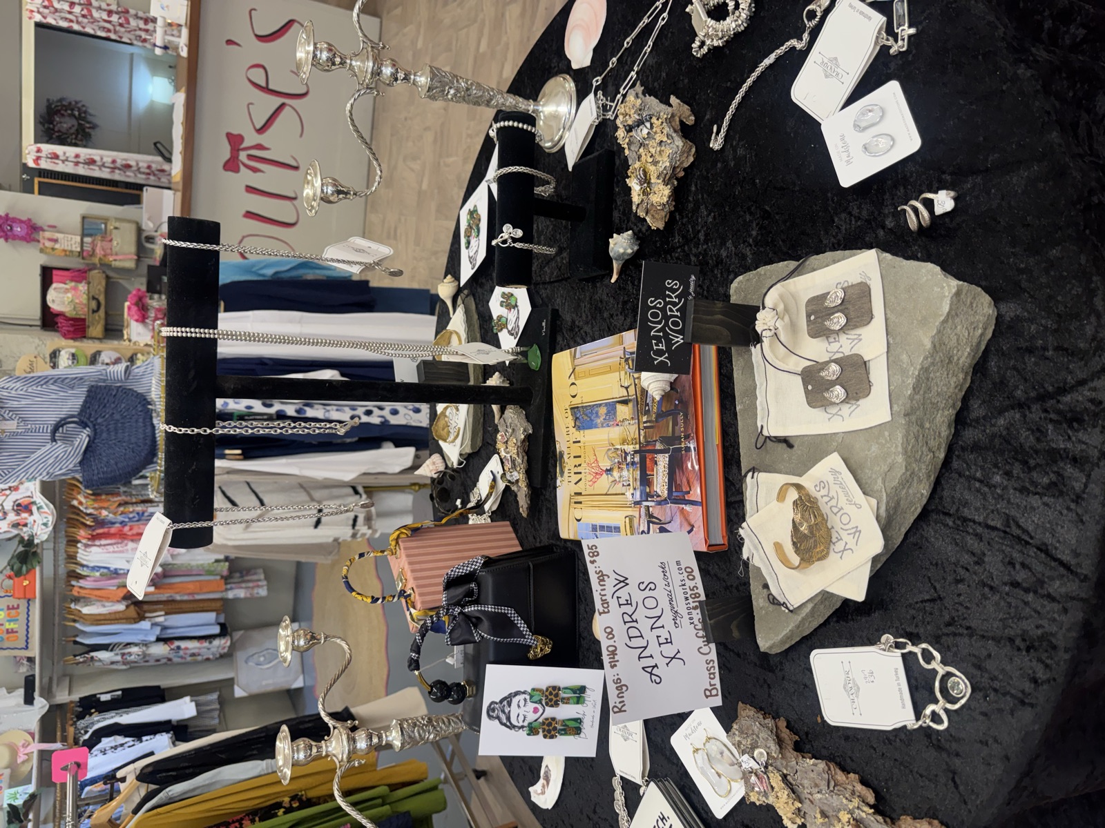 The jewelry table beneath the painted Louise's sign